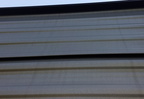 Dirty and Bulged Siding Panels